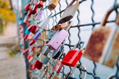 Close-up of padlocks on fence