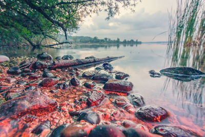 Panoramic shot of rocks in lake against sky