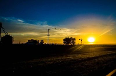 Scenic view of landscape against sky during sunset