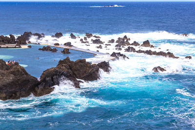 Scenic view of sea against blue sky