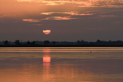 Hot air balloons against sky during sunset