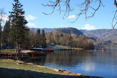 Scenic view of lake and mountains against sky