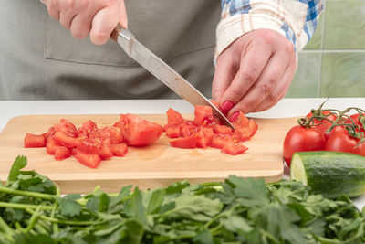 Cropped hand of person preparing food