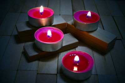 High angle view of tea light candles on table