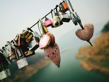Close-up of padlocks hanging on metal