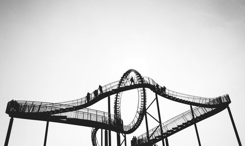 Low angle view of ferris wheel against clear sky