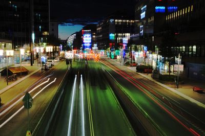 High angle view of light trails on road at night