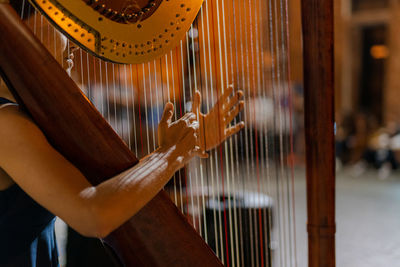 Close-up of guitar playing piano