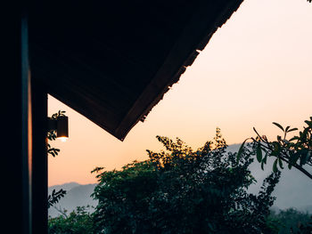 Low angle view of building against sky during sunset