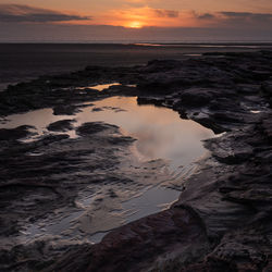 Scenic view of sea against sky during sunset