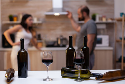 Close-up of wine bottles on table