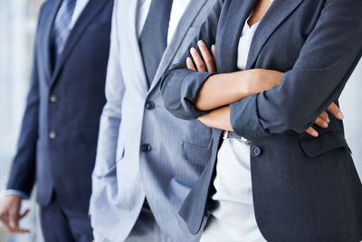 Midsection of man standing against white background