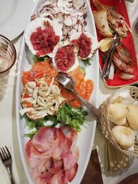 High angle view of fruits in plate on table