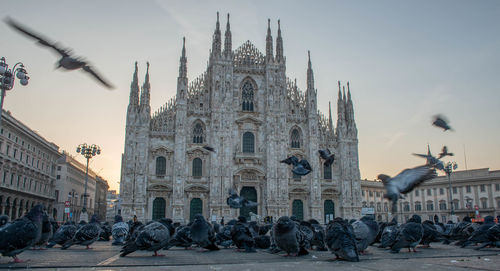 Group of people in front of buildings in city