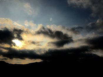 Low angle view of dramatic sky during sunset