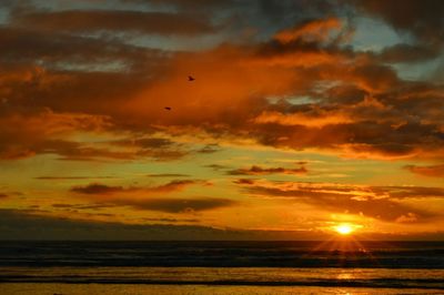 Scenic view of sea at sunset