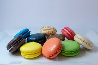 Close-up of multi colored candies against white background