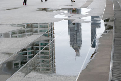 High angle view of steps by buildings in city