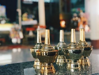 Close-up of candlestick holders on table