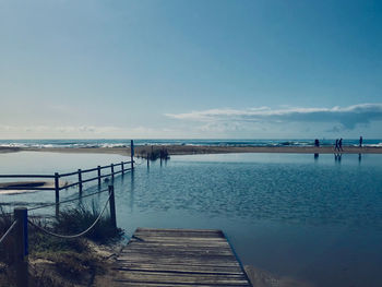 Pier over sea against sky