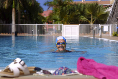 Portrait of man swimming in pool