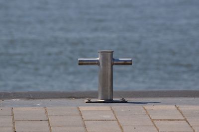 Close-up of pier on sea