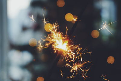 Close-up of illuminated sparklers at night