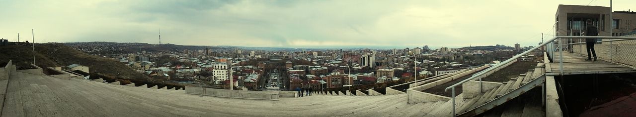 building exterior, architecture, built structure, sky, cloud - sky, house, residential structure, residential building, residential district, cloud, panoramic, town, cloudy, city, day, outdoors, townscape, high angle view, mountain, transportation