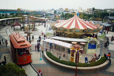 High angle view of people in city against sky