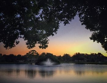 Scenic view of lake at sunset