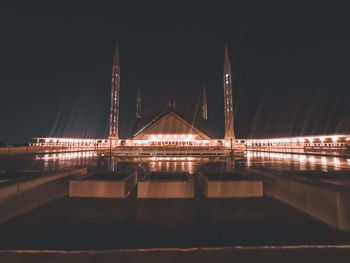 Bridge over river at night