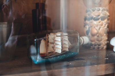 Close-up of ice cream in glass jar on table