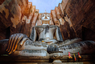 Statue of buddha outside temple