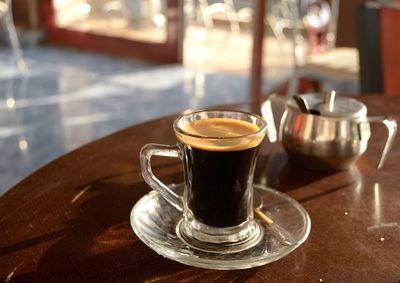 Close-up of coffee cup on table