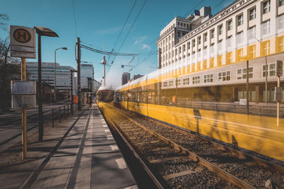 Blurred motion of train at railroad station