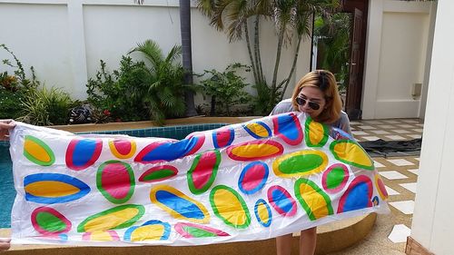 Woman with multi colored umbrella