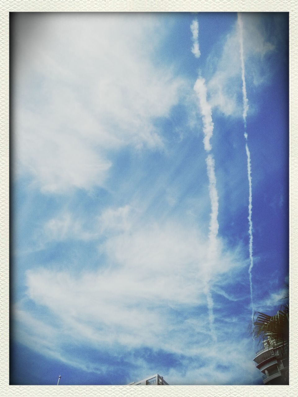 transfer print, low angle view, sky, auto post production filter, blue, cloud - sky, cloud, cloudy, beauty in nature, nature, tranquility, scenics, outdoors, day, no people, tranquil scene, high section, idyllic, sunlight, backgrounds