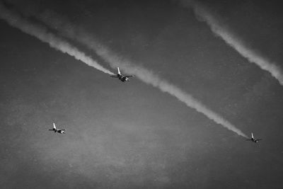Low angle view of airplane flying in sky