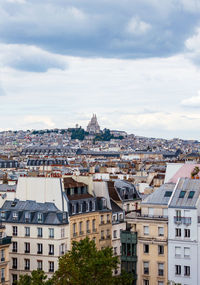 Paris cityscape from above. montmartre hill and sacre coer church stand out in the view