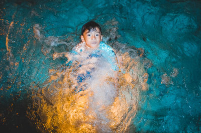 Portrait of woman swimming in pool