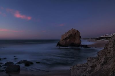 Scenic view of sea against sky at sunset