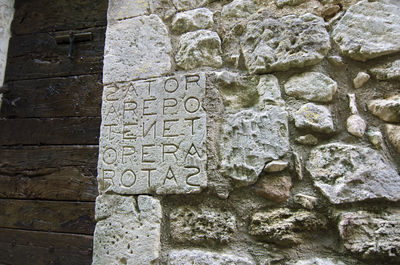 Text on stone wall