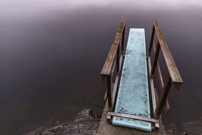 Old metal structure in lake
