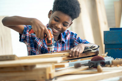 Close-up of man working at workshop