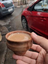 Close-up of hand holding drink