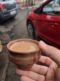 Close-up of hand holding drink