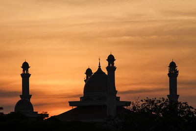 Silhouette of building during sunset