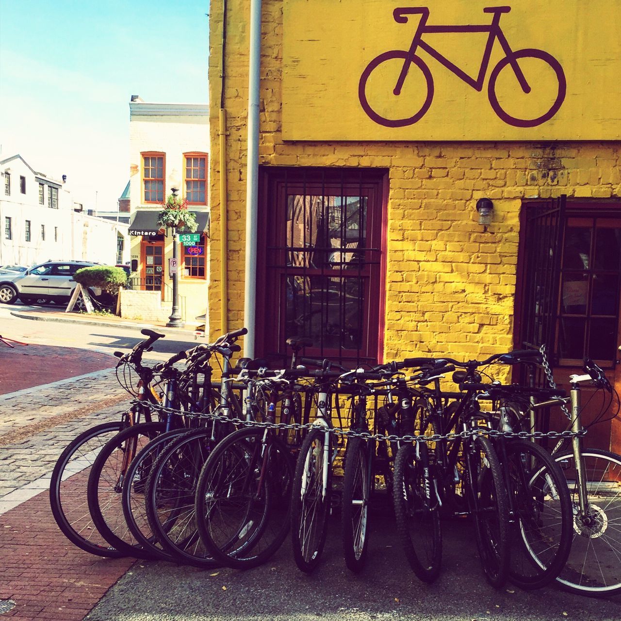 bicycle, building exterior, architecture, built structure, transportation, land vehicle, mode of transport, parked, stationary, parking, street, city, residential structure, house, sidewalk, residential building, wall - building feature, outdoors, day, building
