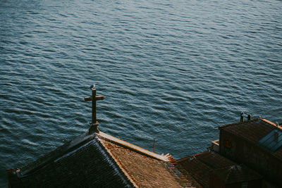 High angle view of buildings by sea