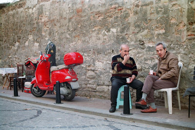 Two men chatting on the street